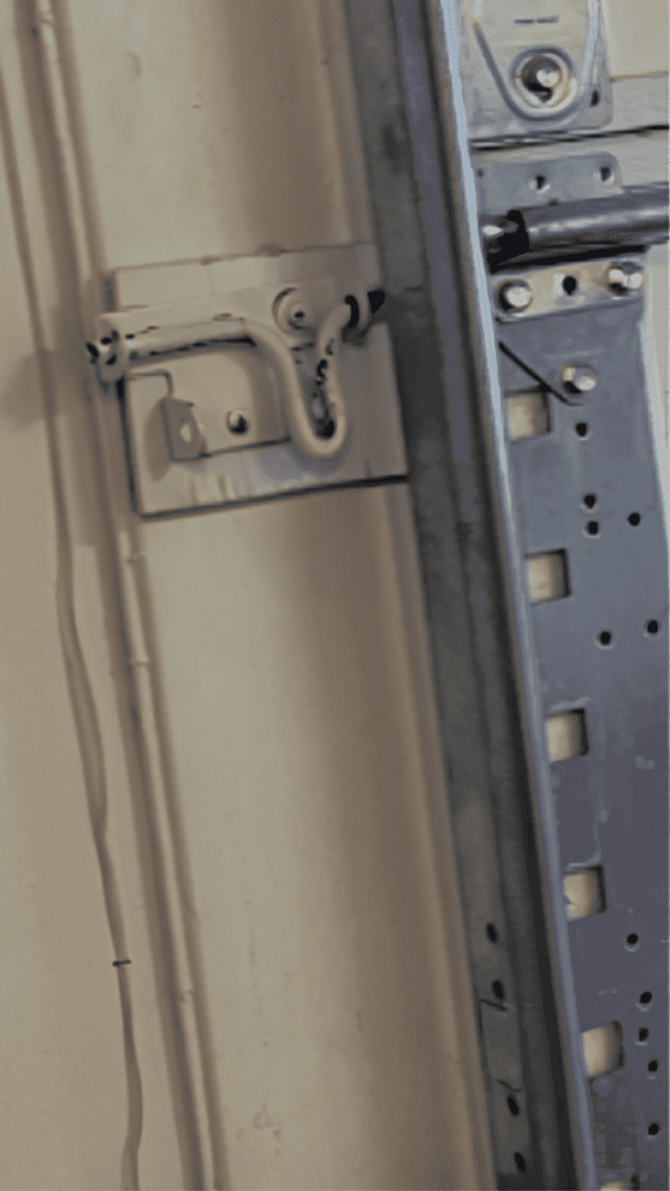 Garage door lock mechanism on wall.